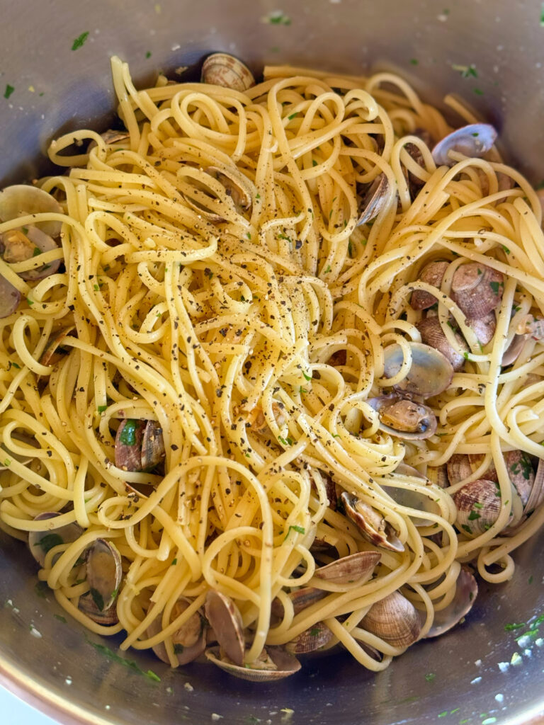 Spaghetti alle vongole recipe by the Puglia Guys. Spaghetti alle vongole is a dish that captures the essence of our summer. It speaks of family and friends gathered together for a lazy lunch by the seaside, or at home. The light and fresh flavours make it ideal for hot days as well as balmy nights.