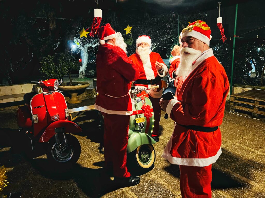 Santa Claus and friends and vespa. For A Very Puglia Christmas by the Puglia Guys