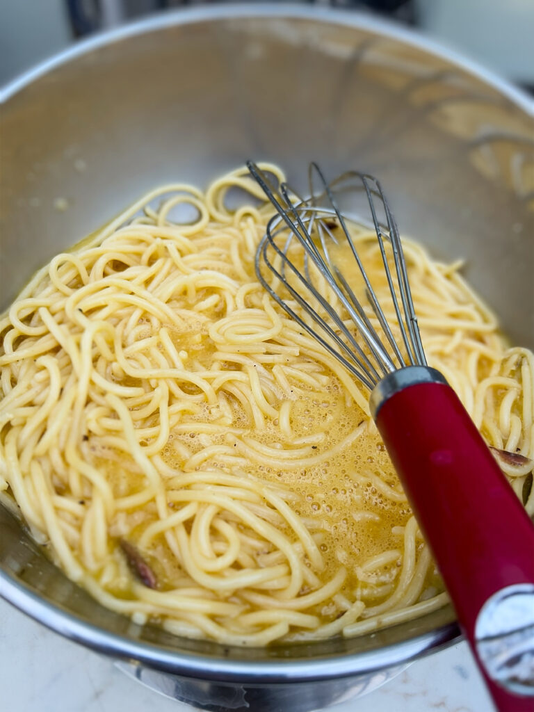 Leftover spaghetti and beaten eggs for Spaghetti frittata recipe from the Puglia Kitchen by the Puglia Guys. 