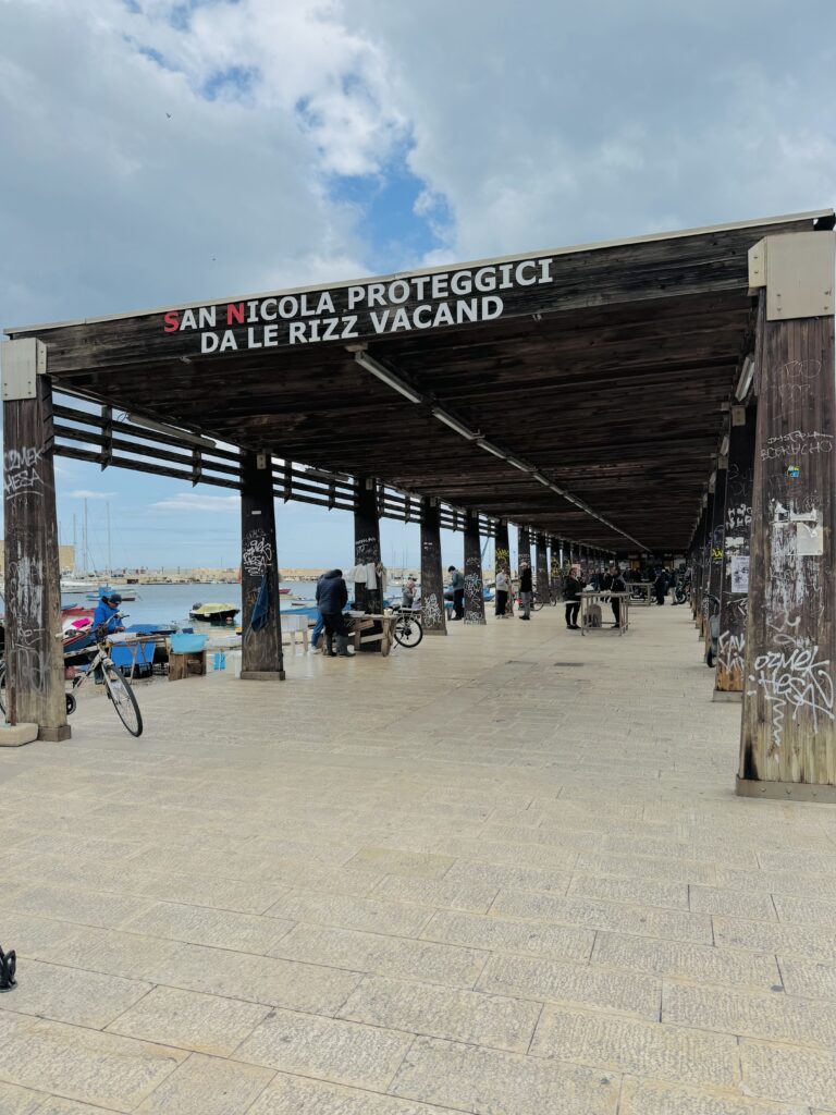 At Bari’s old fishing port we pray to San Nicola to protect us against ”rizz vacand”. Literally asking Saint Nicholas to protect us agains “empty [sea] urchins” and metaphorically against the empty headed. It also alludes to the regional law banning fishing for sea urchins for three years to allow repopulation.

Photo by the Puglia Guys, Puglia ambassadors. PugliaGuys.com