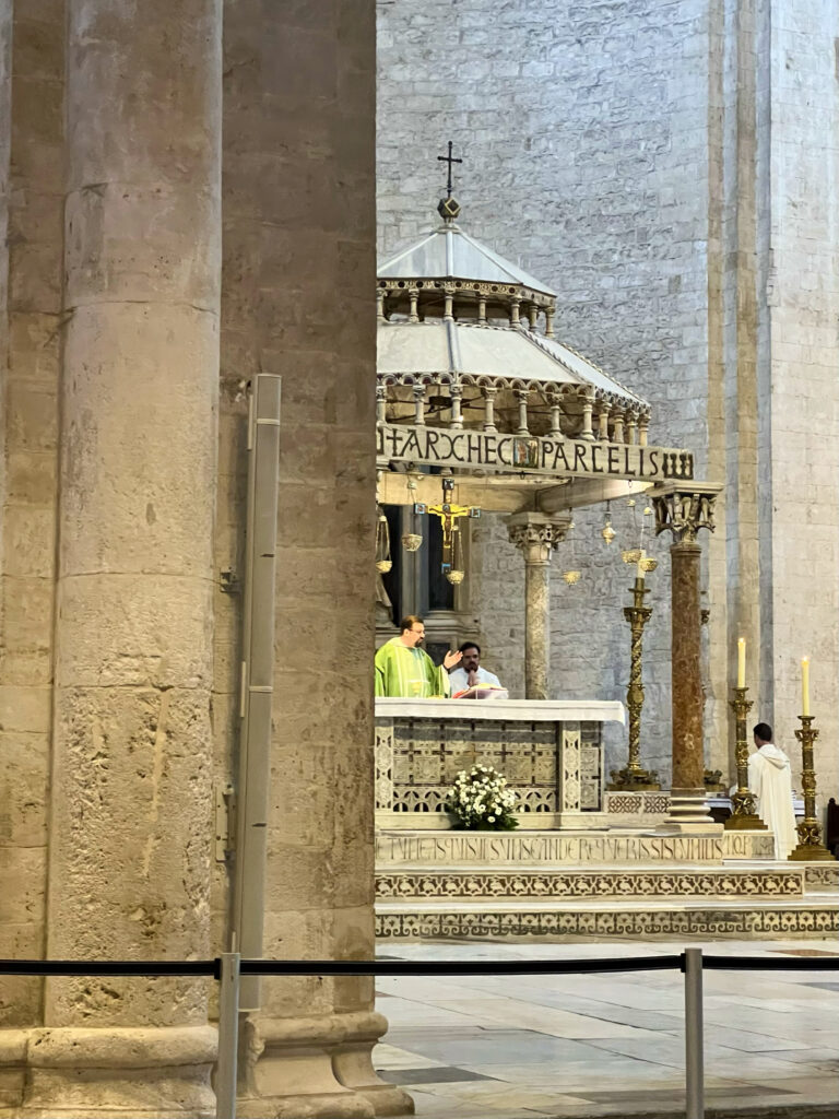 Catholic mass takes place at the altar of the Basilica di San Nicola. The basilica also fosters ecumenical unity, welcoming both Catholic and Orthodox worshippers. In 1966, an Orthodox chapel was established in the crypt, and in 2018, Pope Francis convened religious leaders from the Middle East in Bari to pray for peace, reinforcing the city's role as a bridge between East and West.

Photo by the Puglia Guys, Puglia ambassadors. PugliaGuys.com