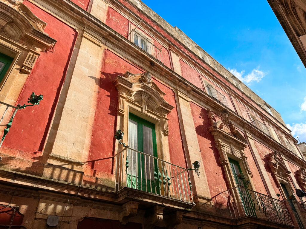 Typical buildings in Martina Franca with wrought iron balconies. The Puglia Guys Martina Franca Guide.

Martina is a town rich in Baroque elegance, historic charm, and cultural heritage. Walking through its winding streets, visitors encounter stunning churches, grand palaces, and picturesque piazzas, each telling a story of the town’s rich past. Our Puglia Guys Martina Franca guide takes you on a journey through the most remarkable sites, from the Gothic convents to the Baroque splendor of its churches and palazzi, with recommendations for the best local restaurants to complete your experience

Nestled in the picturesque Valle d’Itria, approximately halfway between the Ionian and Adriatic Seas, Martina Franca’s strategic position—which allowed for control over trade and commerce, a key factor in the town’s prosperity—played a crucial role in shaping its past, from ancient settlements to medieval fortifications and Baroque splendour. 

For history lovers, art enthusiasts, and cultural explorers, Martina’s churches offer a glimpse into a time when faith and art were inextricably linked, creating monuments that continue to inspire and captivate.

Today, Martina Franca is a vibrant town, the largest of the Valle d’Itria. Its charm lies in its baroque architecture, splendid churches, the narrow streets of its old town, and 18th-century town houses with Baroque features and wrought-iron balconies. Known for its gastronomy (we recommend some of our favourite restaurants, but in reality there is no need to adhere to it, good food is easy to find) its best known culinary export capocollo di Martina Franca (our favourite regional cured meat).

Photo by the Puglia Guys, Puglia Travel ambassadors. PugliaGuys.com
