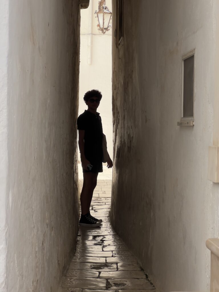 A hidden alleyway in Martina Franca’s old town. From The Puglia Guys Martina Franca Guide.

Martina is a town rich in Baroque elegance, historic charm, and cultural heritage. Walking through its winding streets, visitors encounter stunning churches, grand palaces, and picturesque piazzas, each telling a story of the town’s rich past. Our Puglia Guys Martina Franca guide takes you on a journey through the most remarkable sites, from the Gothic convents to the Baroque splendor of its churches and palazzi, with recommendations for the best local restaurants to complete your experience

Nestled in the picturesque Valle d’Itria, approximately halfway between the Ionian and Adriatic Seas, Martina Franca’s strategic position—which allowed for control over trade and commerce, a key factor in the town’s prosperity—played a crucial role in shaping its past, from ancient settlements to medieval fortifications and Baroque splendour. 

For history lovers, art enthusiasts, and cultural explorers, Martina’s churches offer a glimpse into a time when faith and art were inextricably linked, creating monuments that continue to inspire and captivate.

Today, Martina Franca is a vibrant town, the largest of the Valle d’Itria. Its charm lies in its baroque architecture, splendid churches, the narrow streets of its old town, and 18th-century town houses with Baroque features and wrought-iron balconies. Known for its gastronomy (we recommend some of our favourite restaurants, but in reality there is no need to adhere to it, good food is easy to find) its best known culinary export capocollo di Martina Franca (our favourite regional cured meat).

Photo by the Puglia Guys, Puglia Travel ambassadors. PugliaGuys.com
